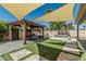 Backyard area featuring a shaded pergola with dining area and outdoor jacuzzi tub at 4665 E Goldfinch Gate Ln, Phoenix, AZ 85044