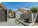 Well-maintained backyard with garden beds, shed, and charming string lights at 4665 E Goldfinch Gate Ln, Phoenix, AZ 85044