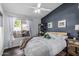 Cozy bedroom featuring a queen bed, hardwood floors, and a window with natural light at 4665 E Goldfinch Gate Ln, Phoenix, AZ 85044