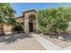 Welcoming home entrance with a brick walkway and archway providing curb appeal at 4665 E Goldfinch Gate Ln, Phoenix, AZ 85044
