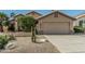 Charming single-story home with a two-car garage, desert landscaping, and well-maintained yard at 4665 E Goldfinch Gate Ln, Phoenix, AZ 85044
