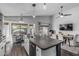 Bright kitchen with a breakfast nook and island seating that flows to a dining room at 4665 E Goldfinch Gate Ln, Phoenix, AZ 85044