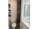 Updated bathroom with new vanity, a decorative mirror, and a tiled walk-in shower at 510 N Alma School Rd # 259, Mesa, AZ 85201