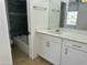 Updated bathroom with new vanity, a decorative mirror, and a tiled shower and tub at 510 N Alma School Rd # 259, Mesa, AZ 85201