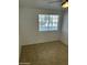 Bright bedroom with window and tile floor at 510 N Alma School Rd # 259, Mesa, AZ 85201