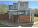 Two-story townhouse with brick fence and well-maintained front yard under a clear blue sky at 510 N Alma School Rd # 259, Mesa, AZ 85201