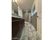 Modern bathroom featuring beautiful tile floors, elegant vanity, and a bright window at 5431 W Cholla St, Glendale, AZ 85304