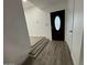 Inviting entryway featuring modern floors, a decorative front door, and neutral wall paint at 5431 W Cholla St, Glendale, AZ 85304