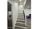 Staircase featuring modern floors and decorative metal railings at 5431 W Cholla St, Glendale, AZ 85304