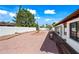 Landscaped backyard with mature trees, fountain, and a quaint seating area at 5434 E Acoma Dr, Scottsdale, AZ 85254