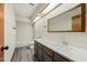Bright bathroom with an extended countertop and a shower-tub combination at 5434 E Acoma Dr, Scottsdale, AZ 85254