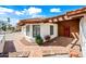 Home featuring a red tile walkway and roof, a covered front entrance, and desert landscaping at 5434 E Acoma Dr, Scottsdale, AZ 85254