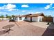 Rear exterior of the home with a red tile roof, patio, and gravel landscaping at 5434 E Acoma Dr, Scottsdale, AZ 85254