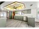 Bright kitchen features granite countertops, stainless steel appliances, and modern gray cabinets at 5434 E Acoma Dr, Scottsdale, AZ 85254