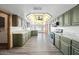 Bright kitchen features granite countertops, stainless steel appliances, and modern gray cabinets at 5434 E Acoma Dr, Scottsdale, AZ 85254