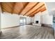 Bright and airy living room boasts a vaulted ceiling, brick fireplace, and access to the outdoor patio at 5434 E Acoma Dr, Scottsdale, AZ 85254