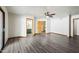 Bright main bedroom with a ceiling fan, and doors to the bathroom with double sinks and a walk-in closet with shelving at 5434 E Acoma Dr, Scottsdale, AZ 85254