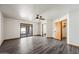 Spacious main bedroom with a ceiling fan, a sliding door to the sunroom, and doors to the bathroom and walk-in closet at 5434 E Acoma Dr, Scottsdale, AZ 85254
