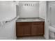 Modern bathroom with double sinks, granite countertops and ample storage space at 5654 W Villa Theresa Dr, Glendale, AZ 85308