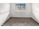 A bright bedroom featuring tile flooring and a window providing natural light at 5654 W Villa Theresa Dr, Glendale, AZ 85308