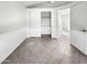Bedroom featuring a sliding door closet, tile flooring, and white walls at 5654 W Villa Theresa Dr, Glendale, AZ 85308