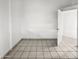 Bedroom featuring tile flooring, white walls, and a white door to the right at 5654 W Villa Theresa Dr, Glendale, AZ 85308