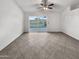 Unfurnished living room with a glass sliding door to the backyard and tiled flooring at 5654 W Villa Theresa Dr, Glendale, AZ 85308
