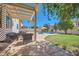 Outdoor oasis with a refreshing pool, lush green grass, and comfortable seating at 6925 W Tonto Dr, Glendale, AZ 85308