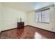 The bedroom features hardwood floors, neutral paint, and ample natural light at 6925 W Tonto Dr, Glendale, AZ 85308