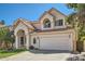 Beautiful two-story house featuring a terracotta roof, stucco exterior, and attached two-car garage at 6925 W Tonto Dr, Glendale, AZ 85308