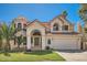 Elegant two-story home with desert landscaping, a terracotta roof, and a two-car garage at 6925 W Tonto Dr, Glendale, AZ 85308