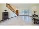 Inviting living room showcasing tile floors, staircase, and lots of natural light from the windows at 6925 W Tonto Dr, Glendale, AZ 85308