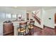 Wet bar features granite countertop, dark wood cabinets, and seating for three at 6925 W Tonto Dr, Glendale, AZ 85308