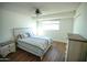 Bedroom featuring a bed, nightstand, dresser, wood flooring and a ceiling fan at 6961 E Osborn Rd # B, Scottsdale, AZ 85251