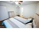 Cozy bedroom with a comfortable bed, ceiling fan, and closet space at 6961 E Osborn Rd # B, Scottsdale, AZ 85251