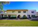 Charming townhome exterior with a red tile roof and well-maintained landscaping at 6961 E Osborn Rd # B, Scottsdale, AZ 85251