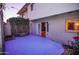 Cozy patio with blue floors and a sliding door that leads into the interior at 6961 E Osborn Rd # B, Scottsdale, AZ 85251