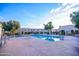 Community pool and building exterior on a sunny day with clear blue sky at 6961 E Osborn Rd # B, Scottsdale, AZ 85251