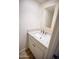 Elegant powder room with a granite countertop vanity and stylish mirror at 6961 E Osborn Rd # B, Scottsdale, AZ 85251