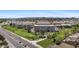 Overhead view of condos backing up to a golf course and a busy street, surrounded by city views at 7930 E Camelback Rd # 409, Scottsdale, AZ 85251