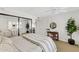 Bright bedroom offers a mirrored closet, ceiling fan, and stylish decor at 7930 E Camelback Rd # 409, Scottsdale, AZ 85251