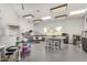 Large craft room with white walls, gray cabinets, several worktables, and storage areas at 7930 E Camelback Rd # 409, Scottsdale, AZ 85251