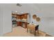 Cozy kitchen and dining area features granite countertops, stainless steel appliances, and wooden cabinetry at 7930 E Camelback Rd # 409, Scottsdale, AZ 85251