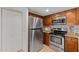 Kitchen features stainless steel appliances, granite countertops, and wooden cabinetry at 7930 E Camelback Rd # 409, Scottsdale, AZ 85251