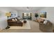 Sunlit living area with neutral tones, balcony access, and contemporary furnishings at 7930 E Camelback Rd # 409, Scottsdale, AZ 85251