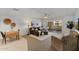 Bright living room with comfortable seating, a dining area, and access to a private balcony at 7930 E Camelback Rd # 409, Scottsdale, AZ 85251