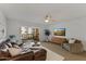 Cozy living room featuring a comfortable leather couch and sliding door access to a balcony at 7930 E Camelback Rd # 409, Scottsdale, AZ 85251