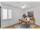 Well-lit home office with modern desk, window shutters and natural light at 7930 E Camelback Rd # 409, Scottsdale, AZ 85251