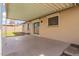 Covered patio with sliding glass doors offers a seamless transition to the outdoors, perfect for relaxing and entertaining at 8014 W Mescal St, Peoria, AZ 85345