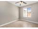 Bedroom with neutral paint, tile floor and window with backyard view at 8014 W Mescal St, Peoria, AZ 85345
